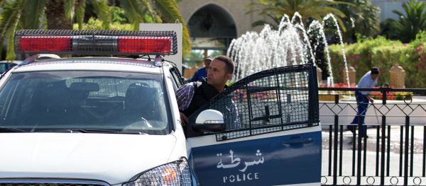 A Tunisian police car patrols in front of the Riu Imperial Marhaba Hotel in Port el Kantaoui, on the outskirts of Sousse south of the capital Tunis, on June 27, 2015 A Tunisian police car patrols in front of the Riu Imperial Marhaba Hotel in Port el Kantaoui, on the outskirts of Sousse south of the capital Tunis, on June 27, 2015 - Sputnik International