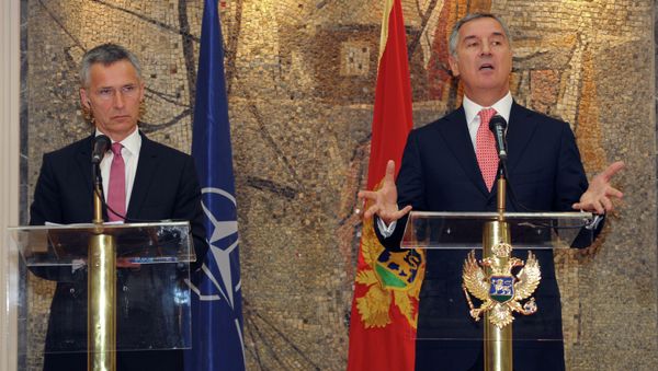 Montenegro's Prime Minister Milo Djukanovic, right, speaks and gestures after talks with NATO Secretary-General Jens Stoltenberg, in Podgorica, Montenegro, Thursday, June 11, 2015 Montenegro's Prime Minister Milo Djukanovic, right, speaks and gestures after talks with NATO Secretary-General Jens Stoltenberg, in Podgorica, Montenegro, Thursday, June 11, 2015 - Sputnik International