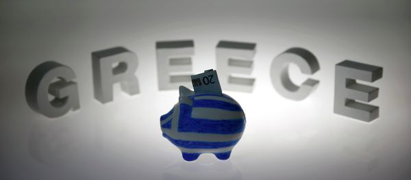 A piggybank painted in the colours of the Greek flag with a 20 euro banknote in it's slot, stands in front of letters spelling the word 'GREECE' in this picture illustration taken in Berlin, Germany June 30, 2015 A piggybank painted in the colours of the Greek flag with a 20 euro banknote in it's slot, stands in front of letters spelling the word 'GREECE' in this picture illustration taken in Berlin, Germany June 30, 2015 - Sputnik International