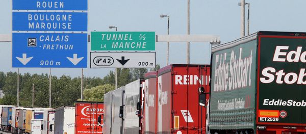 Trucks are stuck in a traffic jam on a highway leading to the Channel tunnel after striking workers invaded the Eurotunnel train tracks in Calais, northern France, in a protest against job cuts, Tuesday, June 30, 2015. Trucks are stuck in a traffic jam on a highway leading to the Channel tunnel after striking workers invaded the Eurotunnel train tracks in Calais, northern France, in a protest against job cuts, Tuesday, June 30, 2015. - Sputnik International