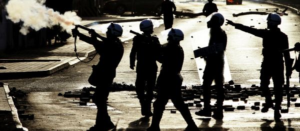 Riot police fire tear gas toward anti-government protesters, unseen, in Jidhafs, Bahrain, on Friday, March 15, 2013 Riot police fire tear gas toward anti-government protesters, unseen, in Jidhafs, Bahrain, on Friday, March 15, 2013 - Sputnik International