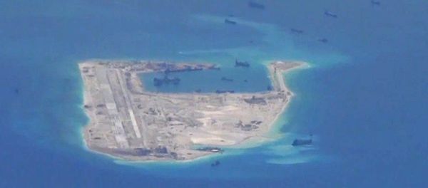 Chinese dredging vessels are purportedly seen in the waters around Fiery Cross Reef. Chinese dredging vessels are purportedly seen in the waters around Fiery Cross Reef. - Sputnik International