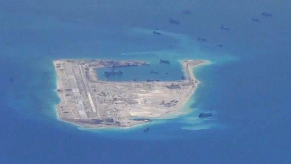Chinese dredging vessels are purportedly seen in the waters around Fiery Cross Reef. Chinese dredging vessels are purportedly seen in the waters around Fiery Cross Reef. - Sputnik International