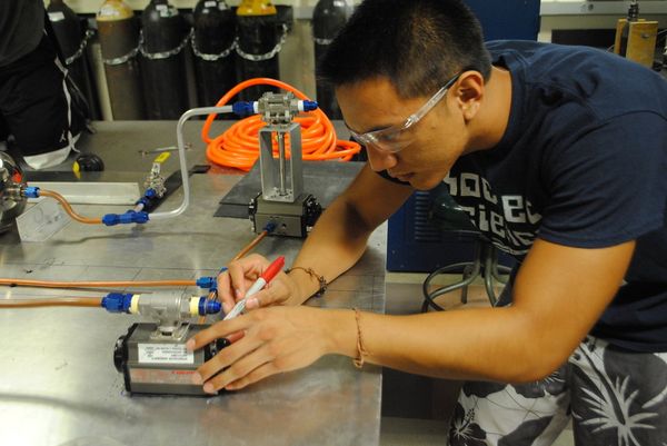 Student from the UCSD chapter of SEDS works on the 3D-printed engine rocket project.  - Sputnik International