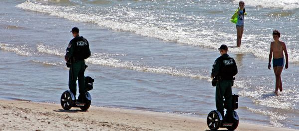 Police officers ride Segway scooters as they patrol the seaside resort of Palanga, Lithuania Police officers ride Segway scooters as they patrol the seaside resort of Palanga, Lithuania - Sputnik International