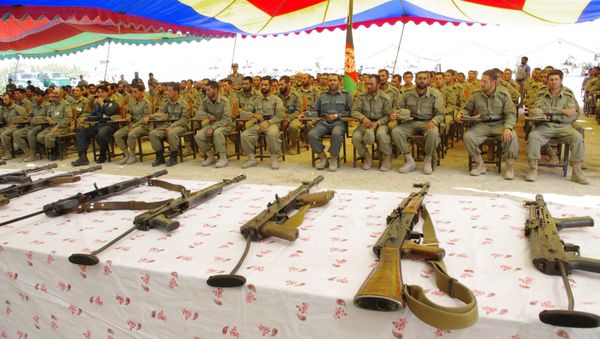 Afghan Local Police (ALP) attend during their graduation ceremony in Laghman province on June 24, 2013. - Sputnik International