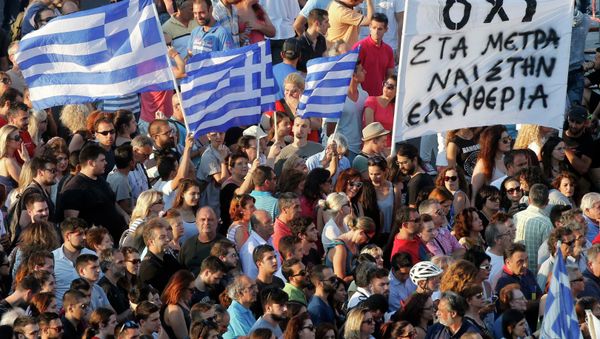 Demonstrators wave greek flags during an anti-austerity rally in front of the parliament building in Athens, Greece, July 3, 2015 Demonstrators wave greek flags during an anti-austerity rally in front of the parliament building in Athens, Greece, July 3, 2015 - Sputnik International