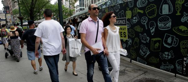 Newlyweds Valasia Limnioti, right, and Konstantinos Patronis walk in Midtown Manhattan, Thursday, July 2, 2015, in New York. The couple topped the dream trip of our lives in New York City, where their three-week honeymoon turned into a nightmare: Their Greek-issued credit cards were suddenly declined and they were left nearly penniless. Strangers from two Greek Orthodox churches in Queens came to their rescue, giving them survival cash until their flight home to Greece this Friday. - Sputnik International