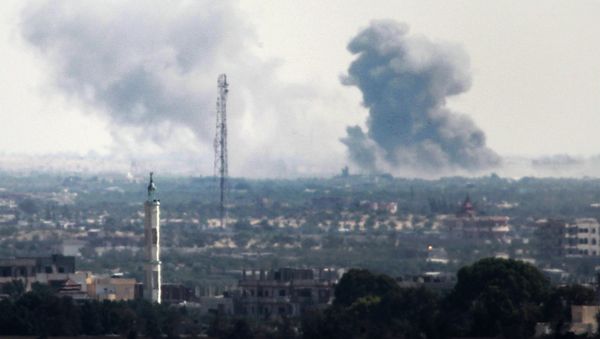 A picture taken from the Rafah border of the southern Gaza Strip with Egypt shows smoke billowing in Egypt's North Sinai on July 2, 2015 - Sputnik International