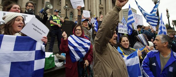 Protestors wave the Greek flag as they shout Oxi (No) during the Melbourne stands with Greece solidarity rally outside Parliament House in Melbourne on July 4, 2015 Protestors wave the Greek flag as they shout Oxi (No) during the Melbourne stands with Greece solidarity rally outside Parliament House in Melbourne on July 4, 2015 - Sputnik International
