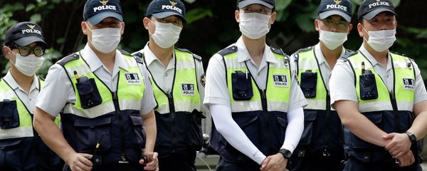 Police officers wearing masks as a precaution against Middle East Respiratory Syndrome (MERS) stand guard during a rally in Seoul, South Korea Police officers wearing masks as a precaution against Middle East Respiratory Syndrome (MERS) stand guard during a rally in Seoul, South Korea - Sputnik International