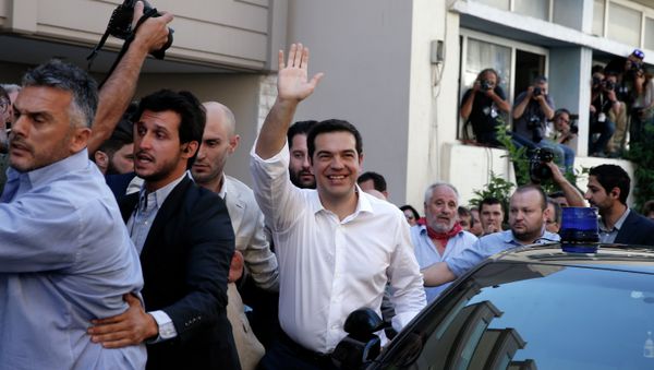 Greece's Prime Minister Alexis Tsipras waves to his supporters after voting outside a polling station in Athens, Sunday, July 5, 2015 Greece's Prime Minister Alexis Tsipras waves to his supporters after voting outside a polling station in Athens, Sunday, July 5, 2015 - Sputnik International