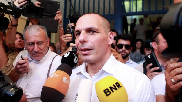 Greek Finance Minister Yanis Varoufakis is surrounded by media as he leaves a polling station during a referendum in Athens, Greece July 5, 2015 Greek Finance Minister Yanis Varoufakis is surrounded by media as he leaves a polling station during a referendum in Athens, Greece July 5, 2015 - Sputnik International