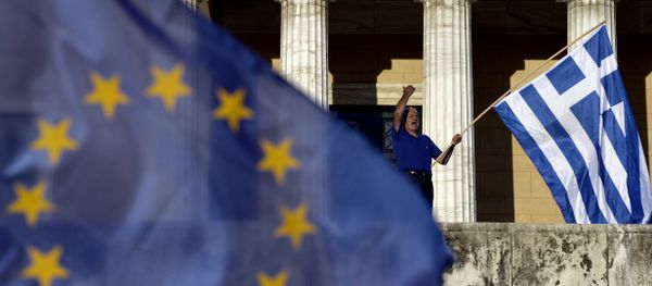 A protester shouts slogans during a pro-European demonstration in front of the Greek parliament in Athens A protester shouts slogans during a pro-European demonstration in front of the Greek parliament in Athens - Sputnik International
