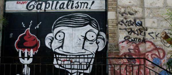 A man passes graffiti in Athens, Tuesday, July 7, 2015. Greek Prime Minister Alexis Tsipras was heading Tuesday to Brussels for an emergency meeting of eurozone leaders, where he will try to use a resounding referendum victory to eke out concessions from European creditors over a bailout for the crisis-ridden country - Sputnik International