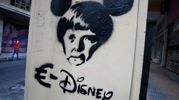 In this photo made on Thursday, June 18, 2015 a man walks behind a stencil depicting German Chancellor Angela Merkel as a Disney character in Athens In this photo made on Thursday, June 18, 2015 a man walks behind a stencil depicting German Chancellor Angela Merkel as a Disney character in Athens - Sputnik International
