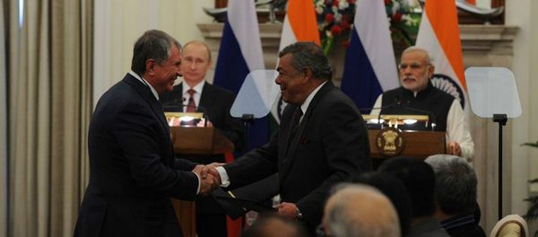 President of Rosneft Igor Sechin, left, and Chairman of Essar Shashi Ruia sign the agreement in New Delhi, December 11, in the presence of the President of the Russian Federation Vladimir Putin and the Prime-Minister of India Narendra Modi. President of Rosneft Igor Sechin, left, and Chairman of Essar Shashi Ruia sign the agreement in New Delhi, December 11, in the presence of the President of the Russian Federation Vladimir Putin and the Prime-Minister of India Narendra Modi. - Sputnik International