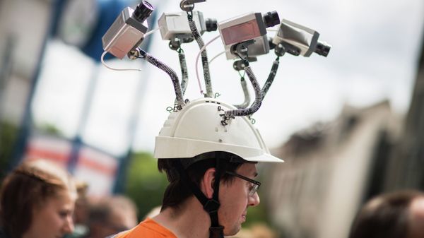 Chairman of Hesse's Pirate Party Volker Berkhout wears a hat with mock surveillance cameras during a demonstration against spying activities of the US intelligence agency NSA and its German partner service BND in Frankfurt am Main, central Germany, on May 30, 2015 Chairman of Hesse's Pirate Party Volker Berkhout wears a hat with mock surveillance cameras during a demonstration against spying activities of the US intelligence agency NSA and its German partner service BND in Frankfurt am Main, central Germany, on May 30, 2015 - Sputnik International