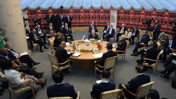 Brazil's President Dilma Rousseff, South Africa's President Jacob Zuma, Russia's President Vladimir Putin, Chinese President Xi Jinping and Indian Prime Minister Narendra Modi sit around the table during a working session at the 7th BRICS summit in Ufa on July 9, 2015 - Sputnik International