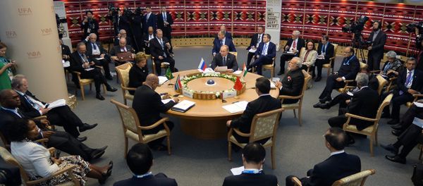 Brazil's President Dilma Rousseff, South Africa's President Jacob Zuma, Russia's President Vladimir Putin, Chinese President Xi Jinping and Indian Prime Minister Narendra Modi sit around the table during a working session at the 7th BRICS summit in Ufa on July 9, 2015 - Sputnik International