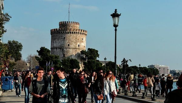 People walk at a main seaside avenue, as the White Tower is seen at the background, in the Greek northern town of Thessaloniki, Greece. People walk at a main seaside avenue, as the White Tower is seen at the background, in the Greek northern town of Thessaloniki, Greece. - Sputnik International