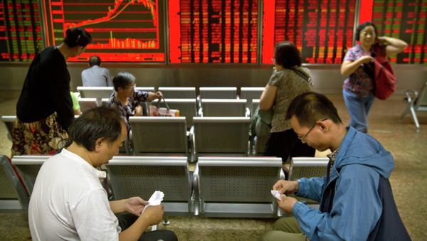 Chinese investors play cards as they sit in a brokerage house in Beijing, Friday, July 10, 2015 Chinese investors play cards as they sit in a brokerage house in Beijing, Friday, July 10, 2015 - Sputnik International