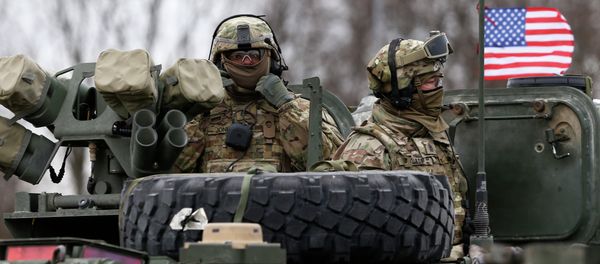 Members of US Army’s 2nd Cavalry Regiment ride on an armored vehicle during the ''Dragoon Ride'' military exercise in Salociai some 178 kms (110 miles) north of the capital Vilnius, Lithuania, Monday, March 23, 2015 - Sputnik International