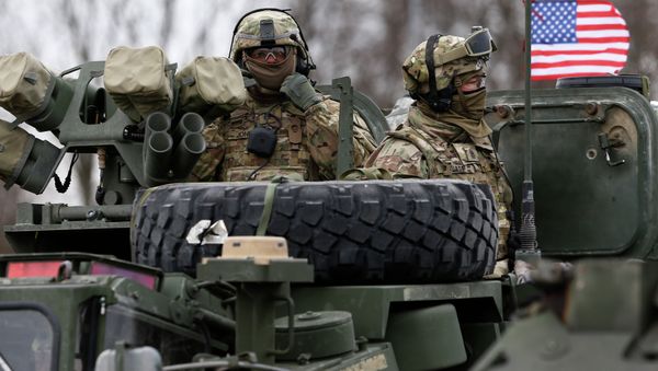 Members of US Army’s 2nd Cavalry Regiment ride on an armored vehicle during the ''Dragoon Ride'' military exercise in Salociai some 178 kms (110 miles) north of the capital Vilnius, Lithuania, Monday, March 23, 2015 - Sputnik International