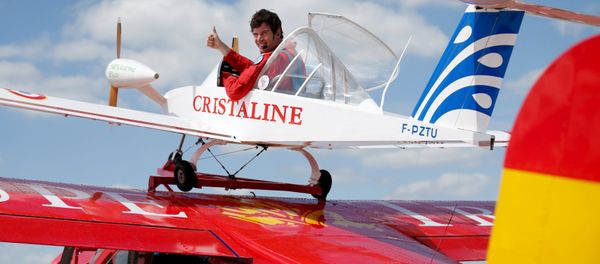 Pilot Hugues Duval in his twin-engined Cri-Cri, one of the world's smallest electrical planes, waits to take off from an old Broussard aircraft, on which it is attached to, during a flying display at the 51st Paris Air Show at Le Bourget airport near Paris, June 19, 2015 - Sputnik International