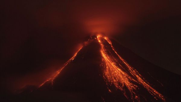 Lava flows down the banks of the Colima Volcano, also known as the Volcano of Fire, near the town of Comala, Mexico, Friday, July 10, 2015 - Sputnik International