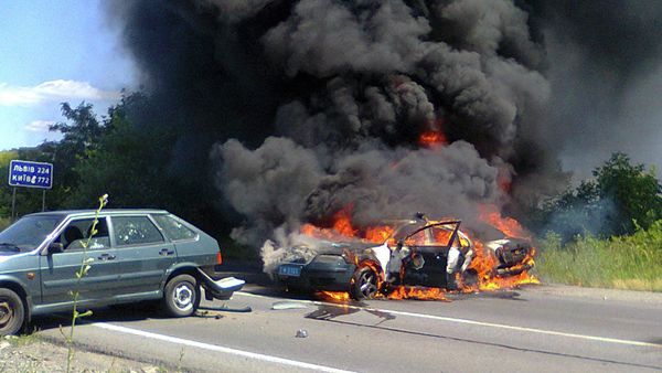 Two police cars on fire are seen at the site of unrest in Mukhachevo, Western Ukraine, Saturday, July 11, 2015 - Sputnik International