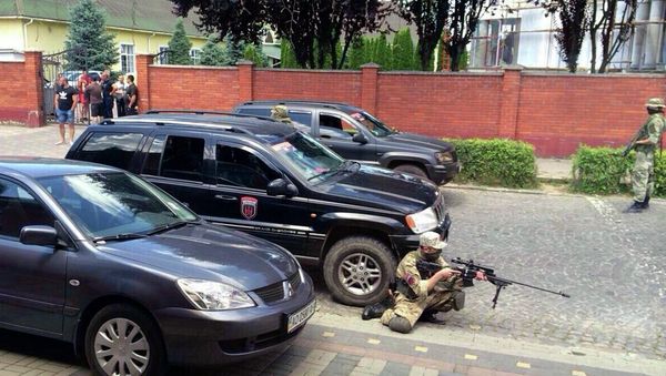 Armed activists of the nationalist militia Right Sector take position in the site of unrest in Mukachevo, Western Ukraine, Saturday, July 11, 2015 Armed activists of the nationalist militia Right Sector take position in the site of unrest in Mukachevo, Western Ukraine, Saturday, July 11, 2015 - Sputnik International
