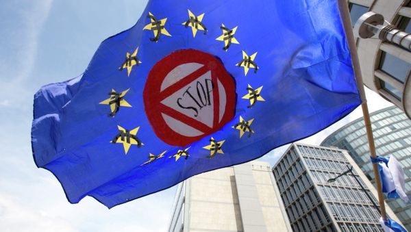 A flag which says stop and has euro money signs in the EU stars flaps in the wind during a protest march in solidarity with Greece in the center of Brussels on Sunday, June 21, 2015 A flag which says stop and has euro money signs in the EU stars flaps in the wind during a protest march in solidarity with Greece in the center of Brussels on Sunday, June 21, 2015 - Sputnik International
