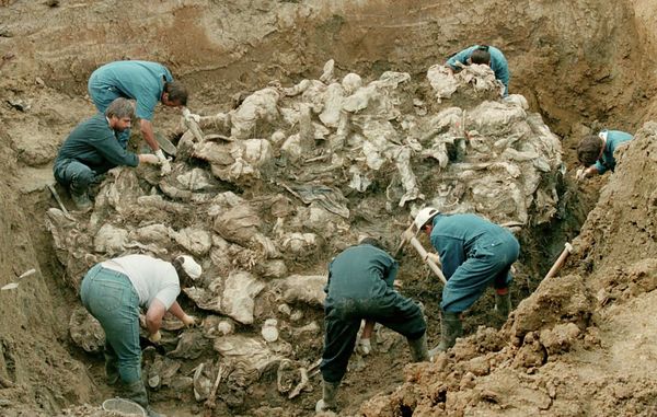 Forensic experts from the International war crimes tribunal in the Hague works on a pile of partly decomposed bodies, 24 July 1996 found in a mass grave in the village of Pilica some 300 km northeast of Sarajevo. The victims in the human sculpture is said to be some of the 7000 men missing after Serbs overran the Moslem enclave of Srebrenica in July 1995 Forensic experts from the International war crimes tribunal in the Hague works on a pile of partly decomposed bodies, 24 July 1996 found in a mass grave in the village of Pilica some 300 km northeast of Sarajevo. The victims in the human sculpture is said to be some of the 7000 men missing after Serbs overran the Moslem enclave of Srebrenica in July 1995 - Sputnik International