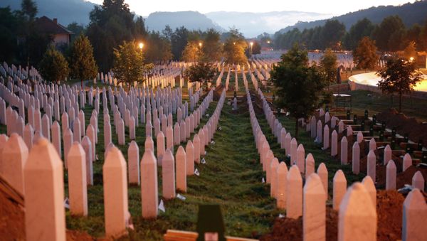 Gravestones are seen at sunrise at a memorial complex near Srebrenica, 150 kilometers (94 miles) northeast of Sarajevo, Bosnia and Herzegovina, Saturday, July 11, 2015 Gravestones are seen at sunrise at a memorial complex near Srebrenica, 150 kilometers (94 miles) northeast of Sarajevo, Bosnia and Herzegovina, Saturday, July 11, 2015 - Sputnik International