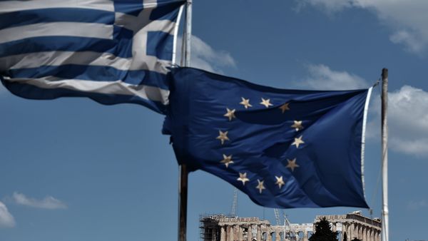 An EU and a Greek flag wave above the ancient temple of Parthenon atop the Acropolis hill in Athens on July 7, 2015 - Sputnik International