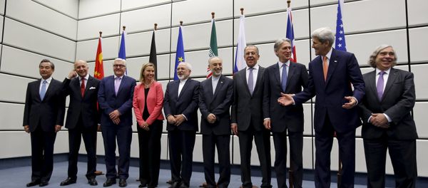 (From L to R) Chinese Foreign Minister Wang Yi, French Foreign Minister Laurent Fabius, German Foreign Minister Frank Walter Steinmeier, European Union High Representative for Foreign Affairs and Security Policy Federica Mogherini, Iranian Foreign Minister Mohammad Javad Zarif, Head of the Iranian Atomic Energy Organization Ali Akbar Salehi, Russian Foreign Minister Sergey Lavrov, British Foreign Secretary Philip Hammon, U.S. Secretary of State John Kerry and U.S. Secretary of Energy Ernest Moniz pose for a group picture at the United Nations building in Vienna, Austria July 14, 2015 - Sputnik International