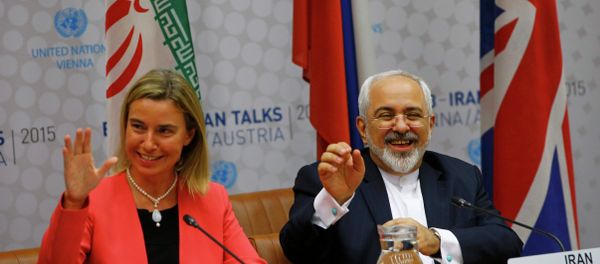 High Representative of the European Union for Foreign Affairs and Security Policy Federica Mogherini and Iranian Foreign Minister Mohammad Javad Zarif (R) react during a plenary session at the United Nations building in Vienna, Austria July 14, 2015. High Representative of the European Union for Foreign Affairs and Security Policy Federica Mogherini and Iranian Foreign Minister Mohammad Javad Zarif (R) react during a plenary session at the United Nations building in Vienna, Austria July 14, 2015. - Sputnik International