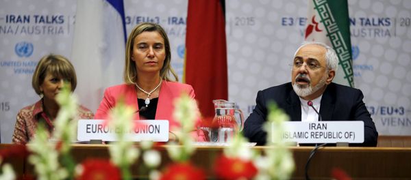 Iranian Foreign Minister Mohammad Javad Zarif speaks next to European Union High Representative for Foreign Affairs and Security Policy Federica Mogherini (L) during a plenary session at the United Nations building in Vienna, Austria July 14, 2015 Iranian Foreign Minister Mohammad Javad Zarif speaks next to European Union High Representative for Foreign Affairs and Security Policy Federica Mogherini (L) during a plenary session at the United Nations building in Vienna, Austria July 14, 2015 - Sputnik International