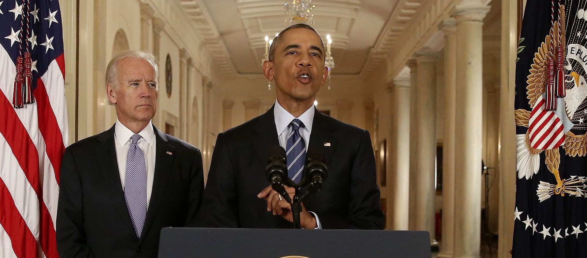 US President Barack Obama speaks with Vice President Joe Biden at his side as he delivers a statement about the nuclear deal reached between Iran and six major world powers during an early morning address to the nation from the East Room of the White House in Washington, 14 July 2015. REUTERS/Andrew Harnik/Pool - Sputnik International, 1920, 06.12.2020