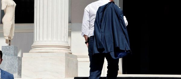 Greek Prime Minister Alexis Tsipras arrives at his office in Athens just after flying in from Brussels on July 13, 2015. Greek Prime Minister Alexis Tsipras arrives at his office in Athens just after flying in from Brussels on July 13, 2015. - Sputnik International