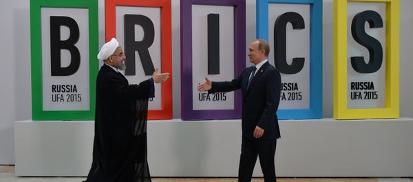 President of the Russian Federation Vladimir Putin, right, and President of the Islamic Republic of Iran Hassan Rouhani at the welcome ceremony for the leaders of the invited states President of the Russian Federation Vladimir Putin, right, and President of the Islamic Republic of Iran Hassan Rouhani at the welcome ceremony for the leaders of the invited states - Sputnik International