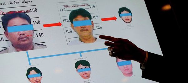 An official from Thailand's Department of Special Investigation points at a chart showing suspects in a human trafficking ring during a news conference in Bangkok, Thailand, Wednesday, July 1, 2015. - Sputnik International