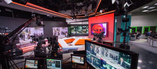 Russia Today newsroom during a live program in English - Sputnik International
