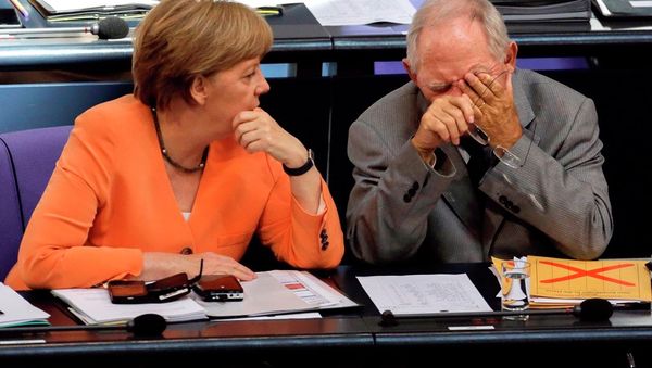German Chancellor Angela Merkel, left, talks to Finance Minister Wolfgang Schaeuble during a debate on the Greek financial crisis at the German parliament in Berlin, Wednesday, July 1, 2015. German Chancellor Angela Merkel, left, talks to Finance Minister Wolfgang Schaeuble during a debate on the Greek financial crisis at the German parliament in Berlin, Wednesday, July 1, 2015. - Sputnik International