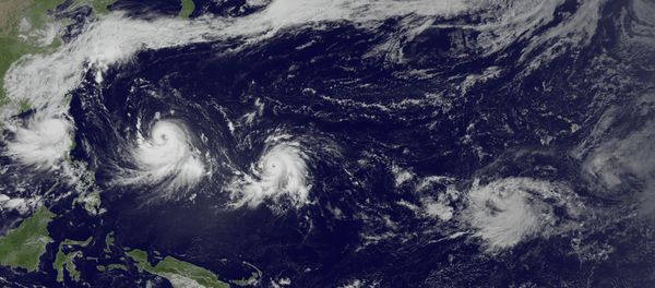 This satellite image taken by the JMA MTSAT-2 satellite at 6:30 a.m. EDT., on Tuesday, July 7, 2015 and released by the National Oceanic and Atmospheric Administration (NOAA), shows three storms in the North Pacific Ocean, from left, tropical storm Linfa, in the South China Sea meandering slowly northward, typhoon Chan-Hom with winds near 100 knots and strengthening, heading west-northwest toward the East China Sea, and typhoon Nangka, east of Guam heading west-northwest This satellite image taken by the JMA MTSAT-2 satellite at 6:30 a.m. EDT., on Tuesday, July 7, 2015 and released by the National Oceanic and Atmospheric Administration (NOAA), shows three storms in the North Pacific Ocean, from left, tropical storm Linfa, in the South China Sea meandering slowly northward, typhoon Chan-Hom with winds near 100 knots and strengthening, heading west-northwest toward the East China Sea, and typhoon Nangka, east of Guam heading west-northwest - Sputnik International