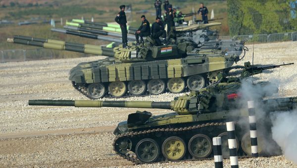 The Angolan crew driving a T-72B tank during the Tank Biathlon 2014 world championship. The competition took place at the training ground of the 2nd Guard Motorized Rifle Taman Division in the village of Alabino The Angolan crew driving a T-72B tank during the Tank Biathlon 2014 world championship. The competition took place at the training ground of the 2nd Guard Motorized Rifle Taman Division in the village of Alabino - Sputnik International