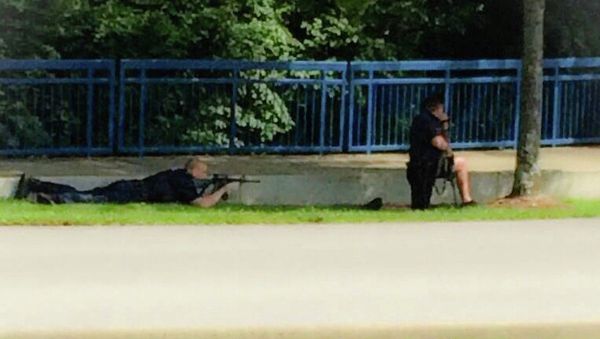 In this image made from video and released by WRCB-TV, authorities work an active shooting scene on amincola highway near the Naval Reserve Center, in Chattanooga, Tenn. on Thursday, July 16, 2015 In this image made from video and released by WRCB-TV, authorities work an active shooting scene on amincola highway near the Naval Reserve Center, in Chattanooga, Tenn. on Thursday, July 16, 2015 - Sputnik International