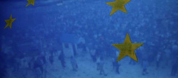 Pro-euro protesters are seen through a European Union flag during a rally in front of the parliament in Athens, Greece, on Thursday, June 18, 2015 Pro-euro protesters are seen through a European Union flag during a rally in front of the parliament in Athens, Greece, on Thursday, June 18, 2015 - Sputnik International