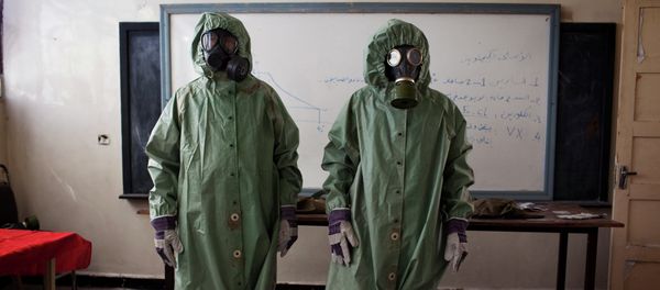 Volunteers wear protective gear during a class of how to respond to a chemical attack, in the northern Syrian city of Aleppo Volunteers wear protective gear during a class of how to respond to a chemical attack, in the northern Syrian city of Aleppo - Sputnik International
